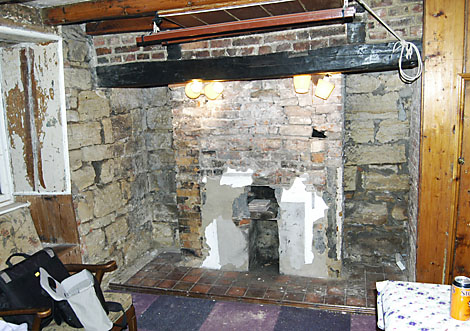 Fireplaces stripped of Plaster and render exposing past alterations