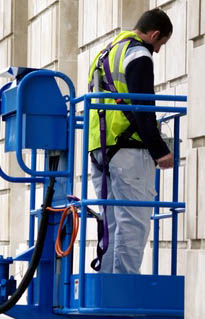 Man with harness in Cherry Picker