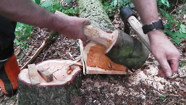 sqauring a log to make a beam using a froe